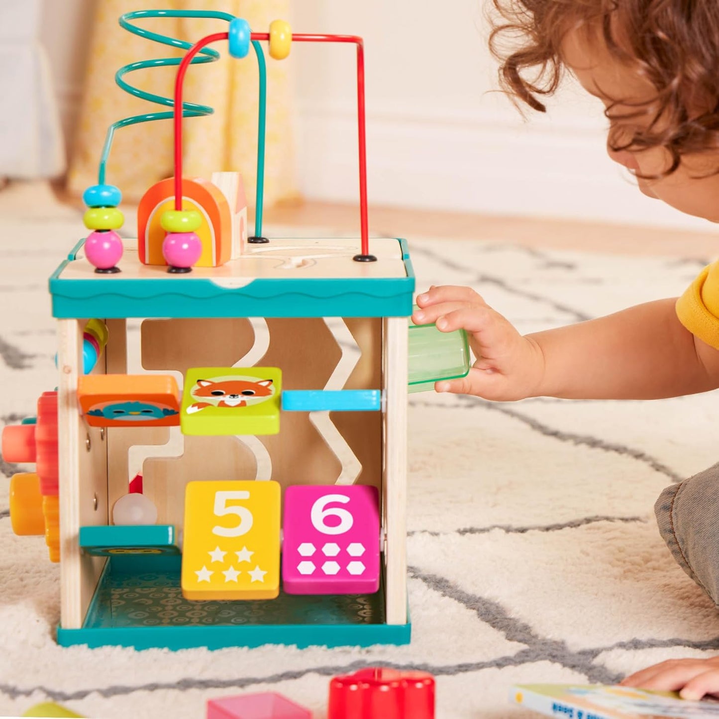 B. toys – Activity Cube – Educational Storybook Included – Wooden Shape Sorter, Bead Maze, Animal Tiles – Top Flips for Compact Storage – 12+ Months – Lil' Learning Cube